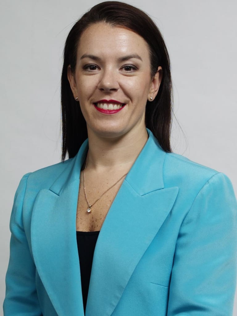 Woman Melissa Caddick in blue jacket