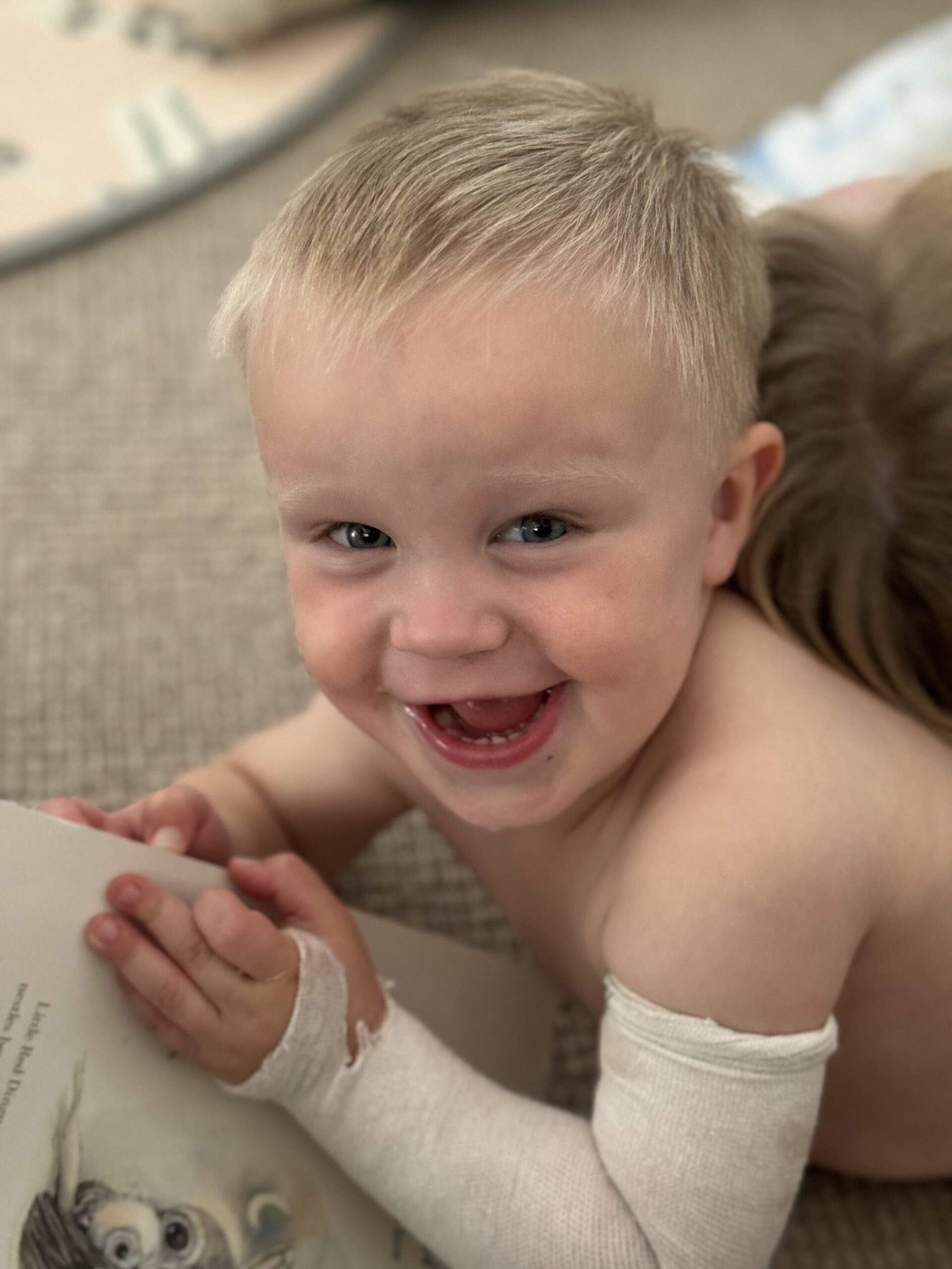 little boy with white bandage on arm